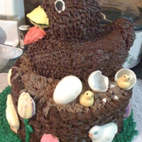 Chocolate Hen In Basket With Chocolate Molded Chicks, Eggs And Tulips triple chocolate cake with chocolate chicks, eggs, and tulips!
