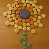Sunflower Out Of Cupcakes The design is from Martha Stewart. Cupcakes were chocolate or white. Frosting was SMBC.TFL!