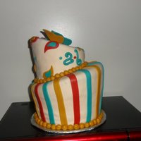 Paisley Topsy Turvy Cake Red Velvet Top layer and Chocolate/vanilla bottom layer. Cover in MMF with MMF details