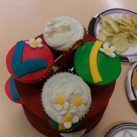 Sprintime Cupcakes Spring time coconut cupcakes with Almond butter cream. MMF fondant decorations and Almond buttercream with ice blue sugar sprinkles.