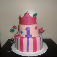 Princess Cake Vanilla and Chocolate Cake covered in pink MMF. All details made from MMF.
