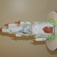 Tall Fairytale Castle With Princess Tall sponge towers supported with a dowel through the centre. Turrets, princess and all modelling in fondant. Creeping plants in royal...