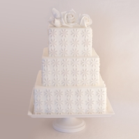3 Tier Cake Gumpaste roses and daisies (in pearl white).