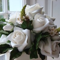 Wedding Cake Topper My wedding cake topper! All gumpaste flowers. It took me several hours but I like the end result.