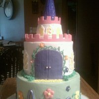 Arica's Birthday Cake Buttercream and fondant castle cake. All edible except for the flag. Very fun and easy to make.