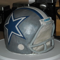 Dallas Cowboys Helmet Lemon version of WASC with lemoncurd buttercream. Fondant with 50/50 fondant gumpaste mask. Broke a bunch of pieces for facemask so left...