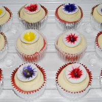 Cupcake Glories Butter-cream swirl with a hand made, hand painted (with food coloring) MMF topper.