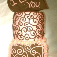 Tierd Love Each tier was triple layer 4in cakes. Very small! Both covered in Chocolate with butter-cream designs or butter-cream with chocolate...