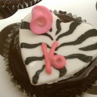 Zebra Print Cupcakes These were for a Sweet Sixteen. Hand painted zebra print on heart shaped MMF. Small rolled rose and buttercream "16" on a...