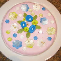 Flower Brithday Cake Gluten free chocolate cake recipe from this site, pink fondant as bottem layer and marzipan flowers. Used eatible decoration spray to give...