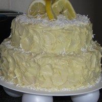 Lemon And Coconut Cake Two tier. Lemon butter cream. Coconut cake with White chocolate whip filling.