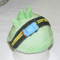 Mini Car On A Country Road 