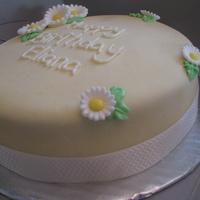 Yellow And White Cake With Candy Dasies 