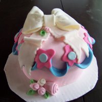 Just A Little Something Vanilla Bean cake with custard and raspberry filling. Covered in buttercream and MMF. Thanks for looking. I'm still learning.