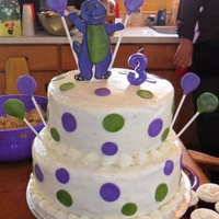 Barney Cake double layer 10inch double layer 8inch, buttercream frosting, fondant Barney, dots and balloons.