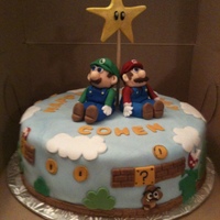 Super Mario Bros Loved making the 3D Mario and Luigi from fondant, and all the other characters and design elements on the side of the cake. The birhday boy...