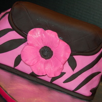 Pink And Black Zebra Stripe Purse With Anemone Flower This is my second attempt at a purse cake and had some carving issues. My cake was just way too crumbly so I didn't get to carve as...