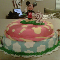 Mickey Mouse & Toy Story Cake this was for a little boys 2nd birthday. he loves mickey mouse and toy story. this was my first cake without any help.. I wish I would have...