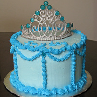 Pretty Princess Royal Icing tiara painted with silver luster dust, and isomalt jewels. This was my first time using either technique, and the customer was...