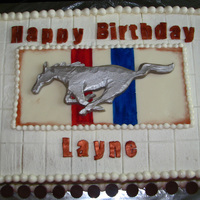 Mustang Cake Mustang, plaque, and letters cut out of white modeling chocolate. The mustang was then shaved to sculpt in the layered look for the legs as...