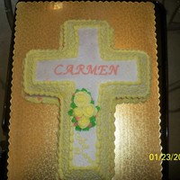 Dedication Cake The is a crossed shaped cake with buttercream Icing. For a Baby dedication.