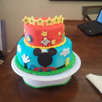 Mickey Mouse Club House Cake This cake is marble with strawberry filling covered in fondant. This is actually my second club house cake but this time I added the stars...