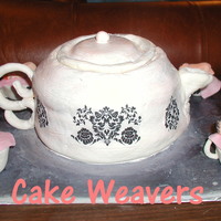 Baby Tea Party Tea pot with cup cakes in tea cup. Everything is home made out of either gum-paste or fondant.