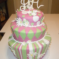 Crazy Daisy Green and pink topsy turvy cake with gum paste daisies.