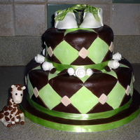 Brown & Green Shower Cake With Giraffe Made this for co-worker of my husband. Bottom is apple cinnamon with brown sugar buttercream, top is yellow with chocolate. Got the shoe...