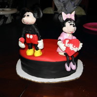 Mickey And Minnie Valentine's Cake My daughter wanted a Mickey and Minnie Valentines cake. The models are made from modeling chocolate and fondant.