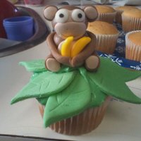 Monkey Cupcakes I make 12 of these for my nephews pre-school. I made each monkey by hand with MMF and added some candy bananas. Took me roughly 6 hours...