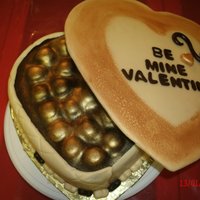 Box Of Chocolate Valentine Cake Heart shaped cake made to look like a box of chocolates..