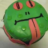 Froggy Cake Made Froggy Cake for my son's 6th B-day. 2 layered 8" round chocolate cakes. Fly and other decorations all MMF
