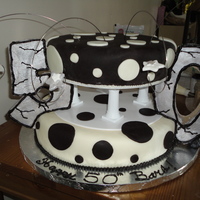 Mom-Mom's 50Th Birthday Cake This is our (my wife, Sara, & I) first attempt at a tiered cake.We made this for my mother's surprise 50th Birthday Party.