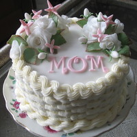 For My Mom Coconut cake with pineapple buttercream filling, buttercream basketweave, all fondant flowers and leaves. I was disappointed the...