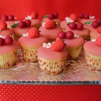 Mini Cupcakes These are little cupcakes with icing and fondant cherries and strawberries.