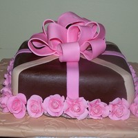 Wilton Gum Paste And Fondant Final Project Cake Vanilla cake with Rasberry Jam and butter creame frosting center and Chocolate Crusting Butter Cream for the Crumb Coat and Chocolate MMF (...