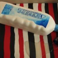 Iceberg Vodka Bottle Cake This is a two layer pecan praline cake with pecan cream cheese filling. the shot glass is made of sugar as well as the poured sugar vodka...