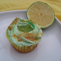 Very Key Lime Cupcakes a tart lime cupcake with keylime pie filling finished with a swirl of lime butter cream dusted with gram crumbs