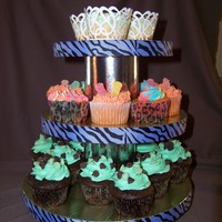 Cupcake Tower mint chocolate cupcakes,lime cupcakes,chocolate raspberry and rainbow fruit cupcakes all on a tower we made at home.