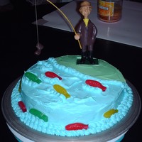Fisherman Cake French vanilla cake with whipped frosting and gummie fish.