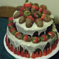Strawberry Ganache Cake Cake for my Mom's surprise birthday party. Almond cake, Chocolate Frosting, White chocolate Ganache. Strawberries dipped in chocolate...