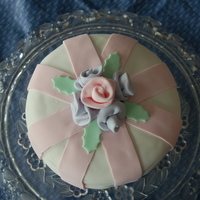 Roses! Here is my first cake i did at home after my first fondant class kinda rough around the edges but not completely horrible for a first timer...