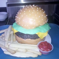 Burger And Fries Cake yellow bun and brownie burger patty covered in MMF, sugar cookie 'french fries', buttercream 'ketchup'