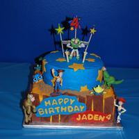 Toy Story The cakes are covered in buttercream. The fence, stars, and name plate are made of fondant.
