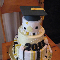 Graduation Cake my first cake cover with cream cheese frosting. The frosting was too thin and ran a little. Probably will stick with buttercream from now...