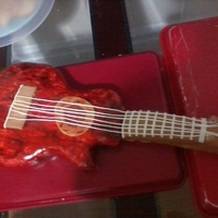 First Time Guitar my first guitar cake sponge cake with old fashioned boiled icing.mmf fondant covered with cherry wood coloring it my son 22end bd