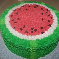Watermelon Memorial Day Cake Two 10" rounds strawberry cake with buttercream frosting and chocolate chips for 'seeds'