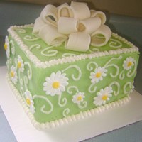 Daisy & Bow Had a bow from decorating class, so made this cake for a friend's b-day. Iced in buttercream. Fondant/Gumpaste bow (my first attempt...