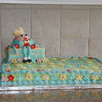Humpty Dumpty Chocolate cake with chocolate buttercream frosting. MMF flowers and accents on wall and on Humpty Dumpty. Cake was for my son's 2nd...